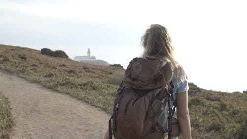 Woman Wearing Backpack Walking Alone