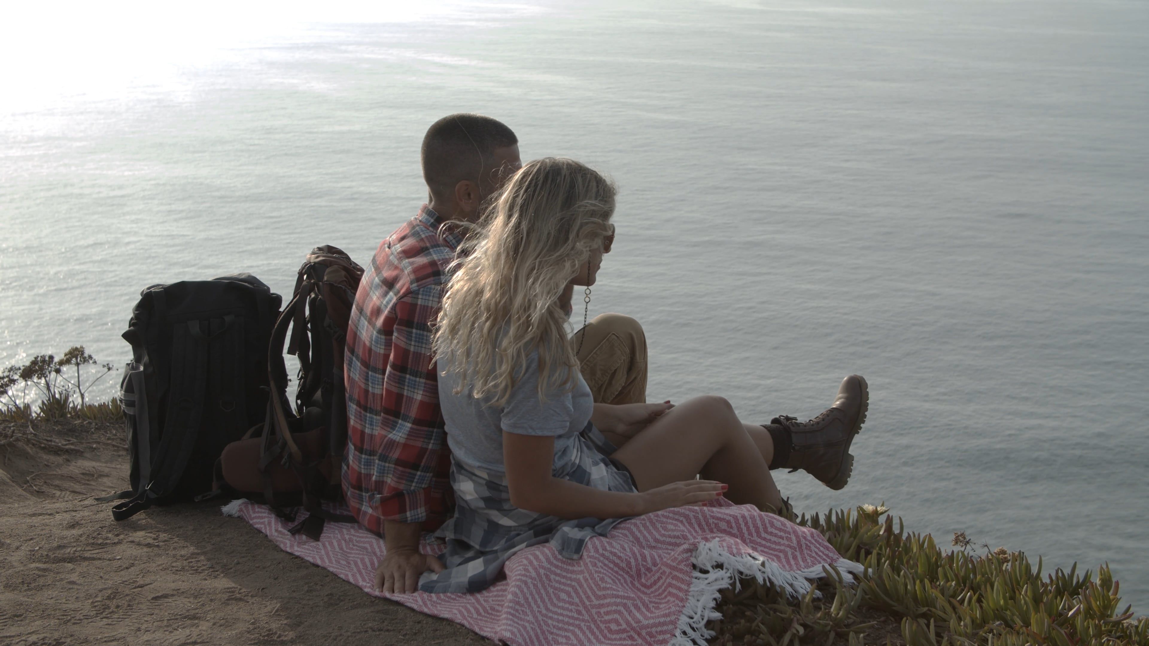 Couple Sitting on Top of a Cliff Free Stock Video Footage, Royalty-Free ...