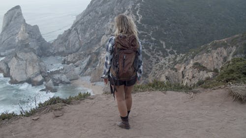 Woman Standing on the Cliff