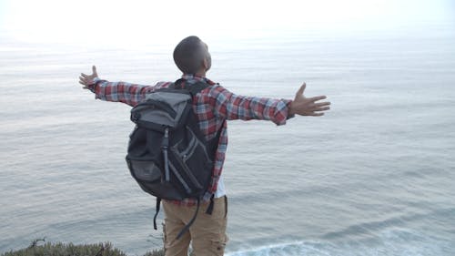 Man Standing on a Cliff