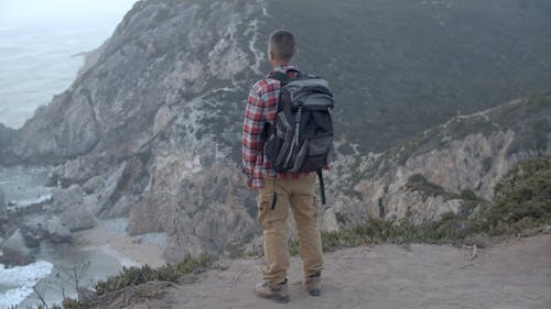 Man Standing on a Cliff