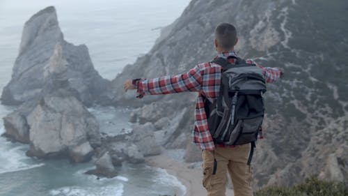 Man Standing on a Cliff