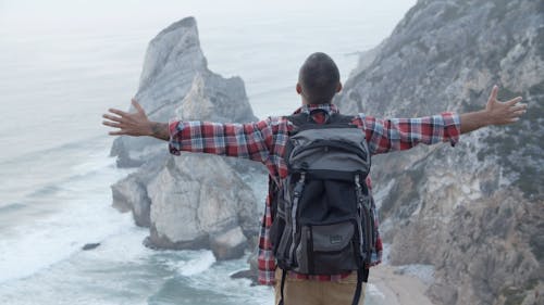 Man Standing on a Cliff