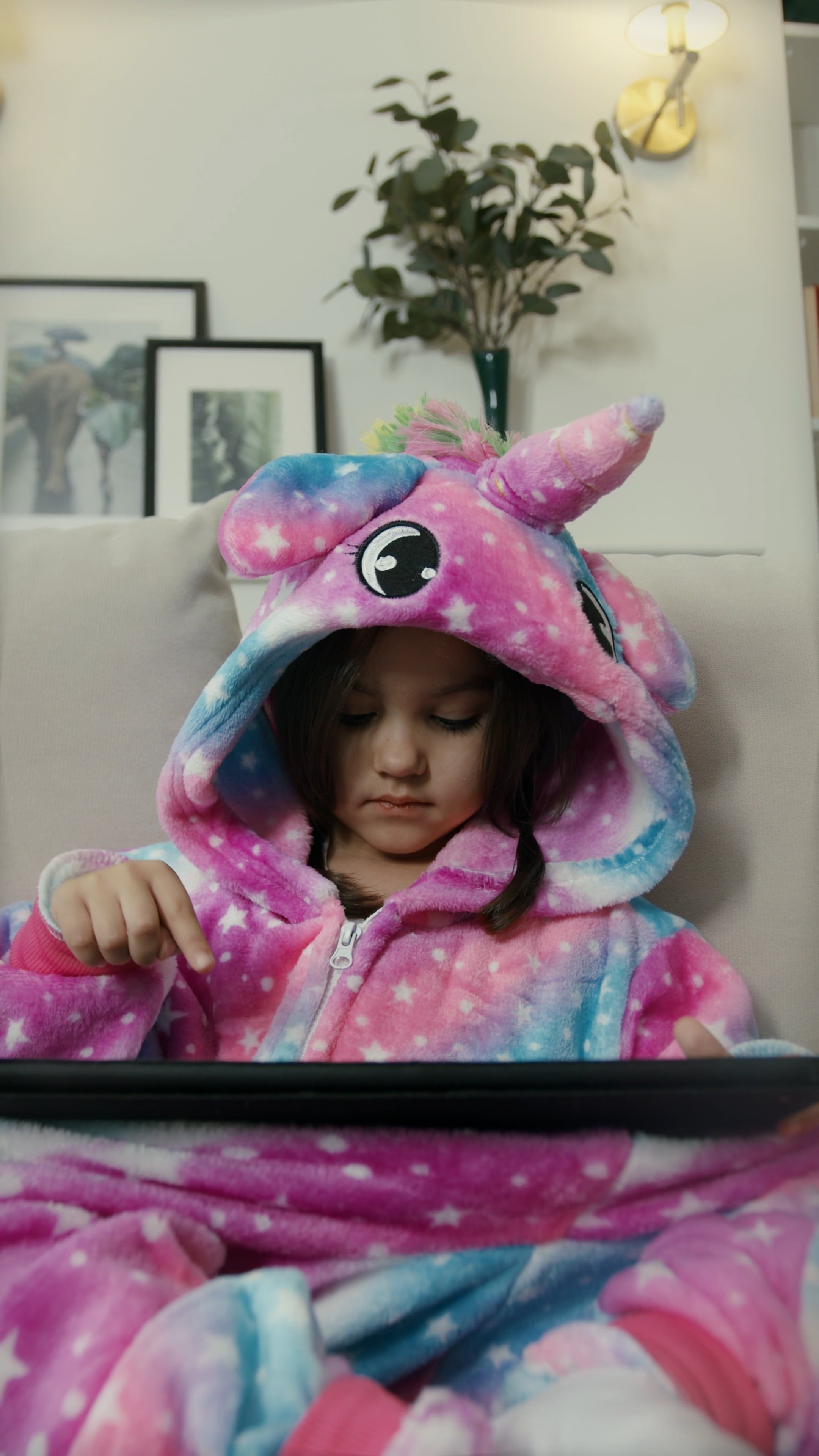 Little Girl In Unicorn Costume Touching Tablet Free Stock Video little-girl-in-unicorn-costume-touching-tablet-free-stock-video