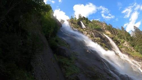 A Majestic Waterfalls From The Rocky Mountain