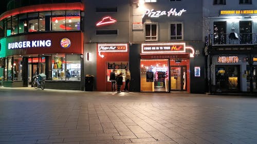 Illuminated City Shops at Night