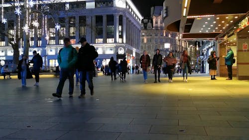 A Busy Walking Street In London At Night