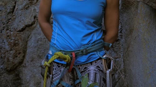 Female Rock Climber Applying Climbing Chalk in her Hands