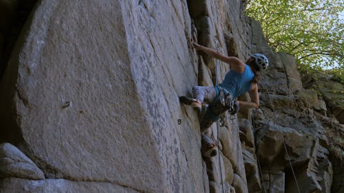 Low Angle View of a Woman Rock Climbing