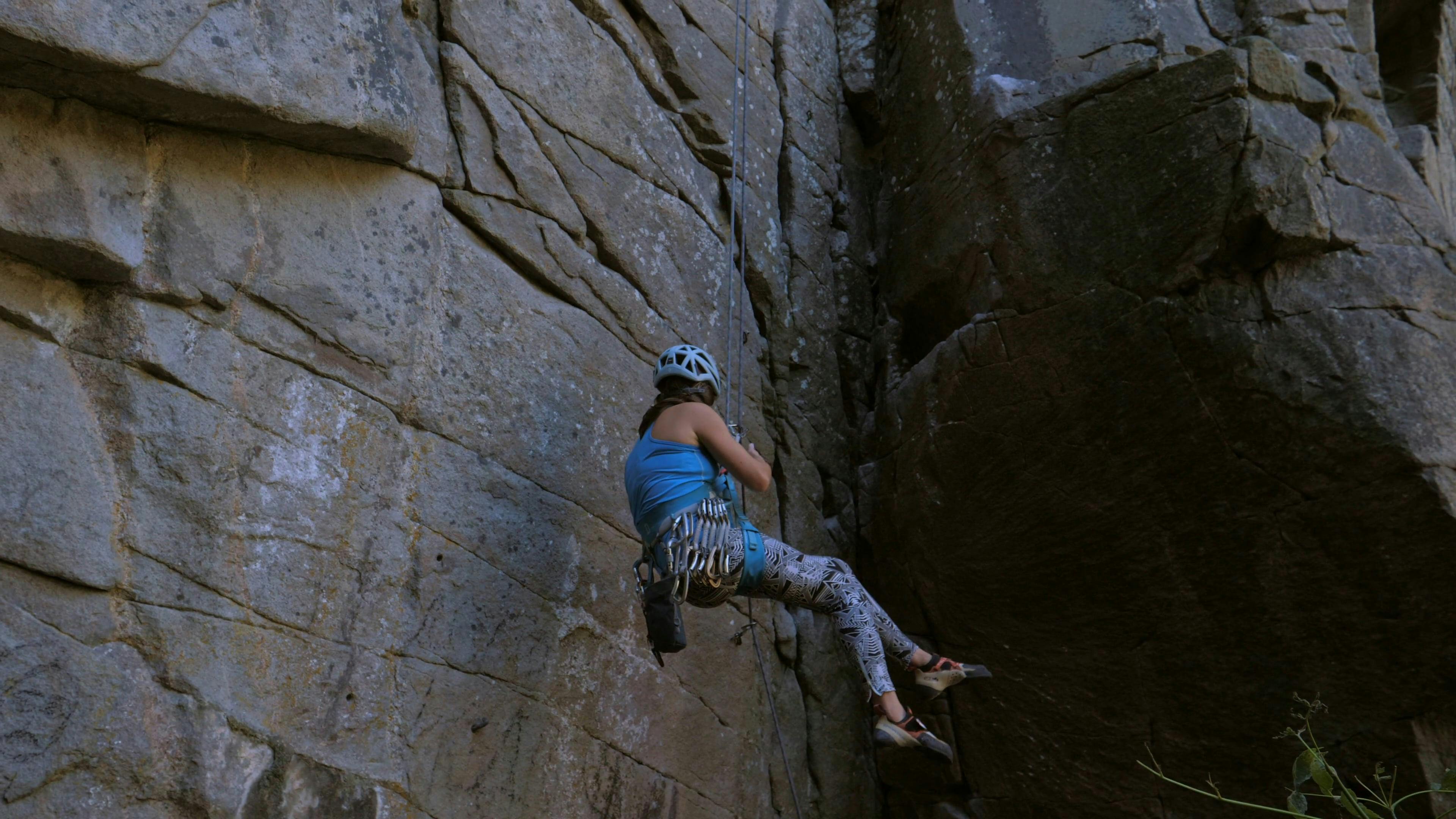 Woman Rappelling Down a Rocky Mountain Side · Free Stock Video