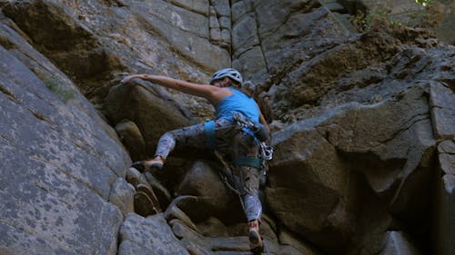 Low Angle View of a Woman Rock Climbing