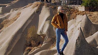 a model standing on the rock