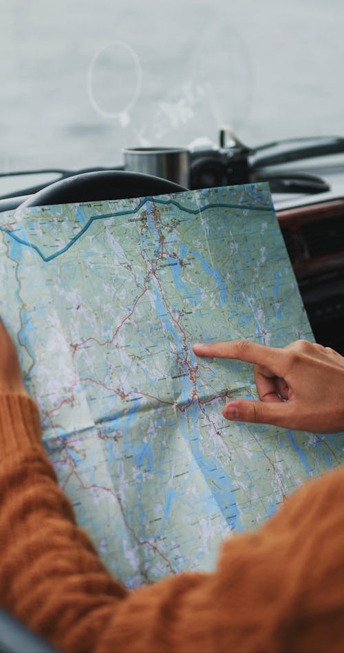 Bearded Man Pointing at Road Map