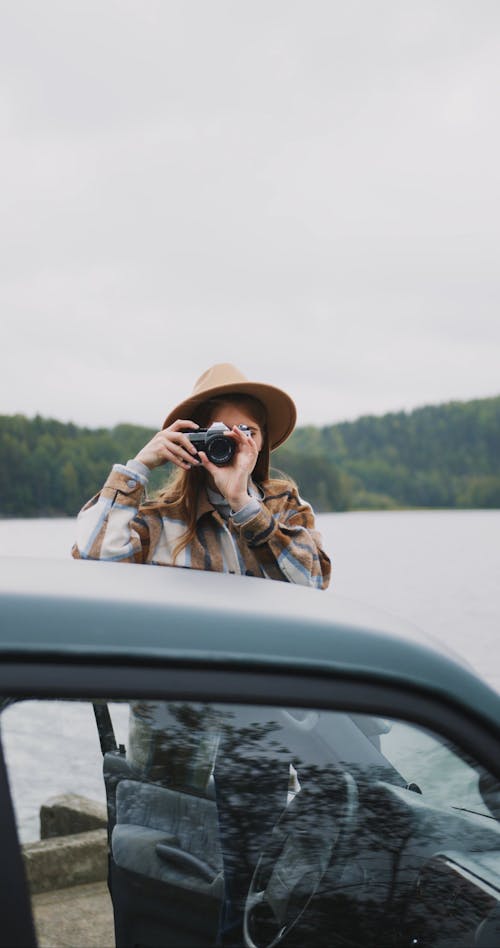 A Woman Engaged In Outdoor Photography