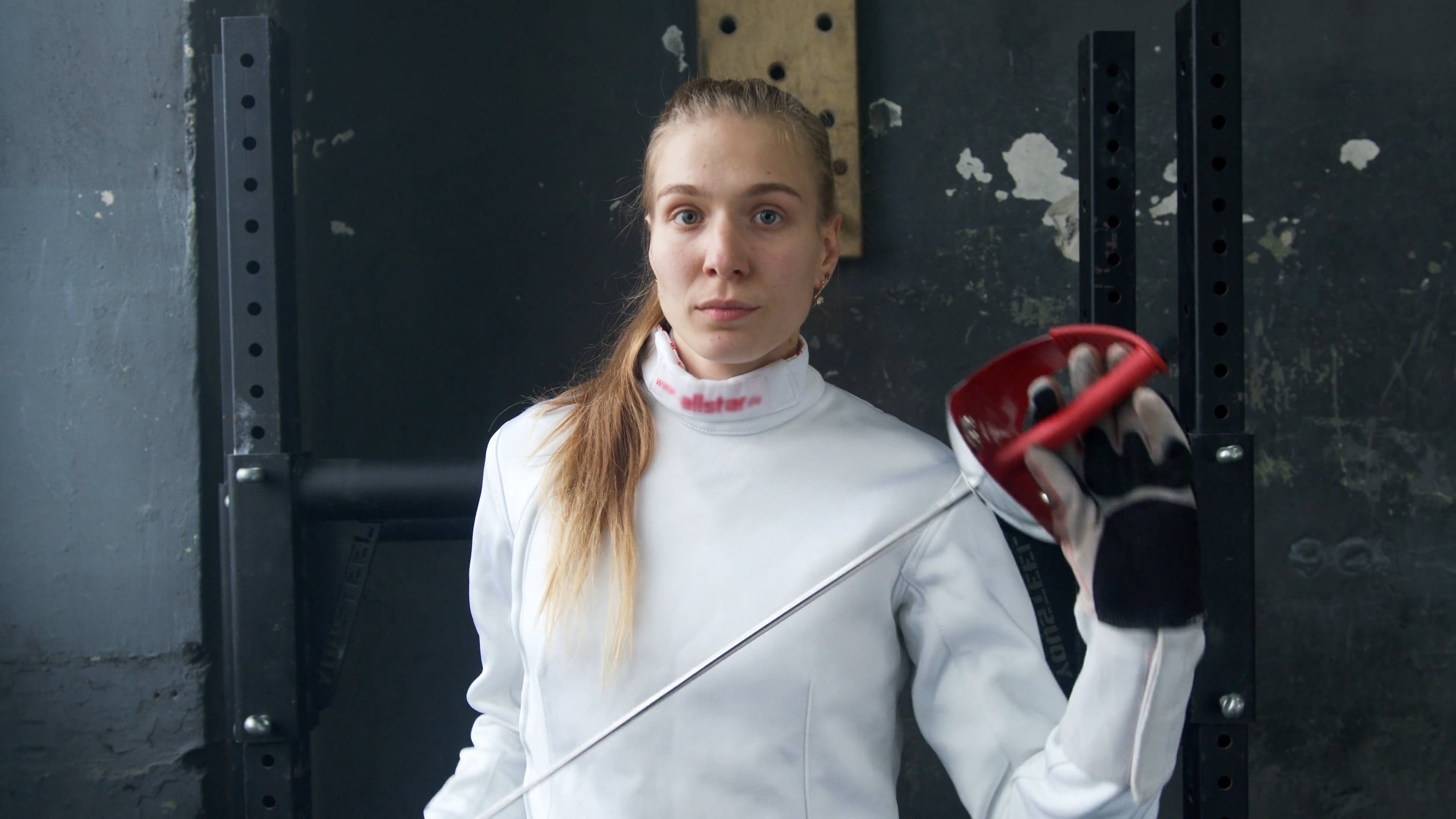 A Woman Posing In Front Of The Camera While Holding Her Sword Free a-woman-posing-in-front-of-the-camera-while-holding-her-sword-free