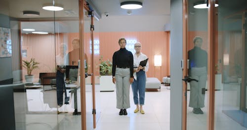 Two Woman Standing In The Doorway