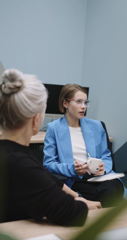 Women Talking during Office Meeting 