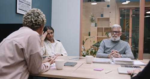 A Group of People Having a Meeting in an Office 
