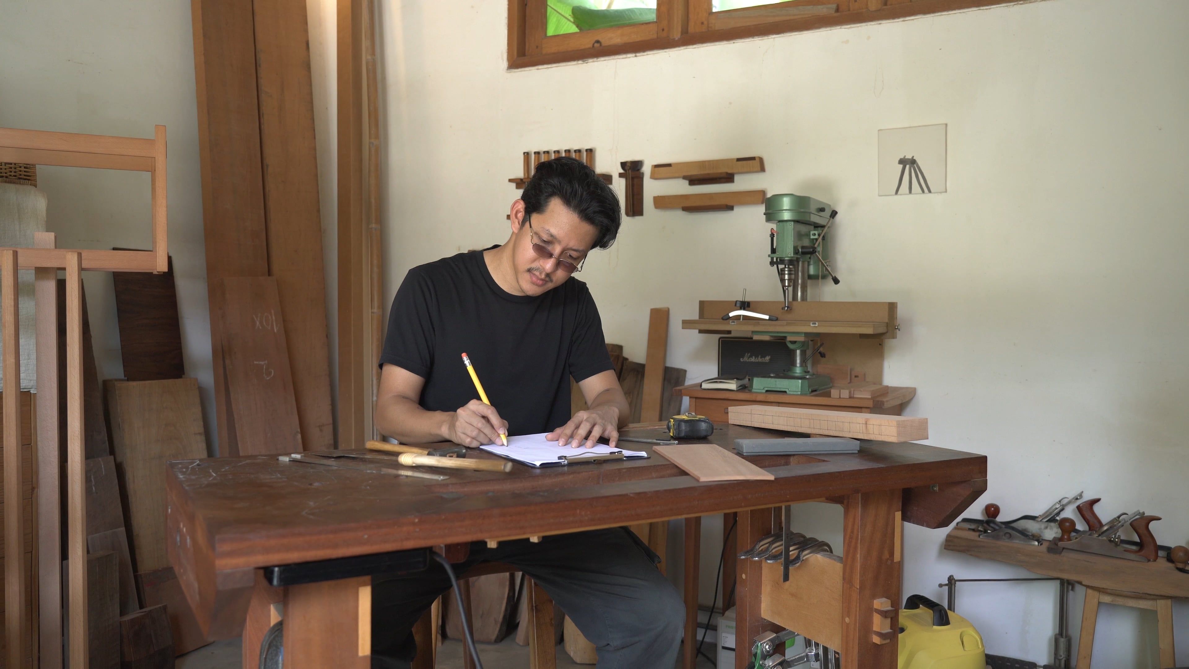 A Man Writing on a Paper · Free Stock Video
