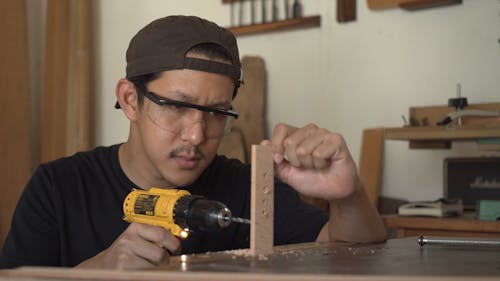 Drilling Holes Through A Wooden Stick