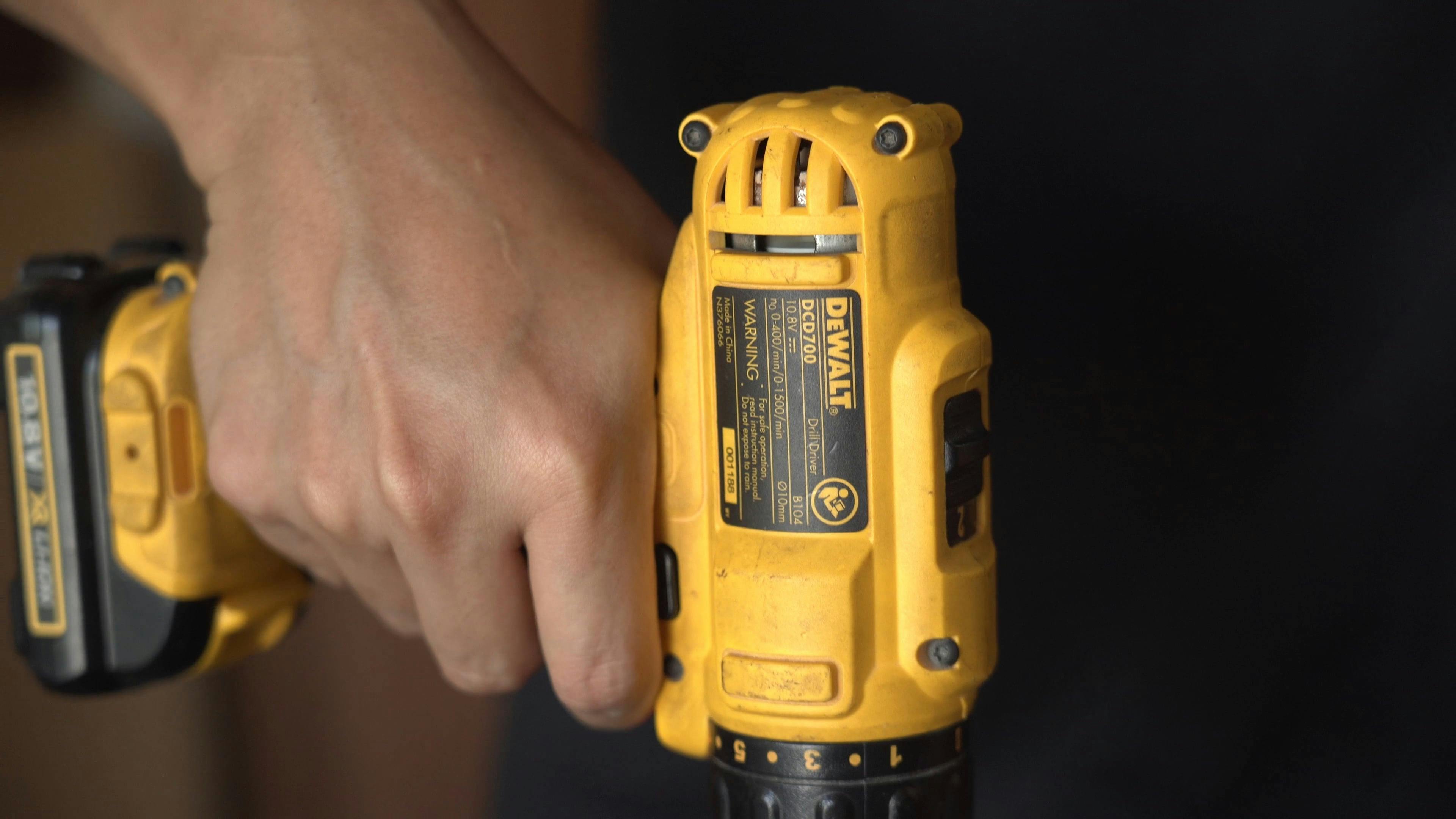 A Person Using a Hand Drill on Wood · Free Stock Video