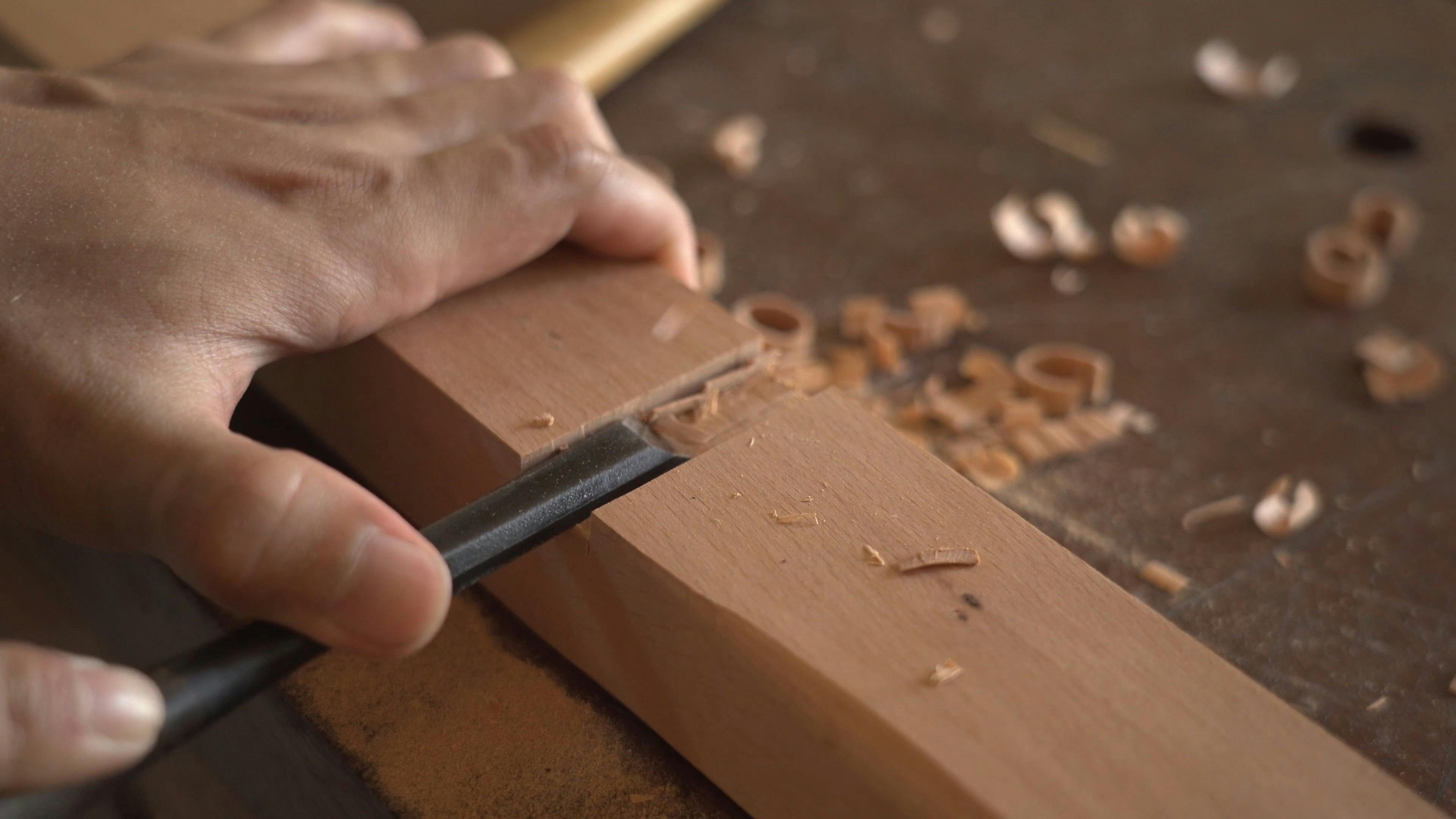 A Person Using a Chisel on Wood · Free Stock Video