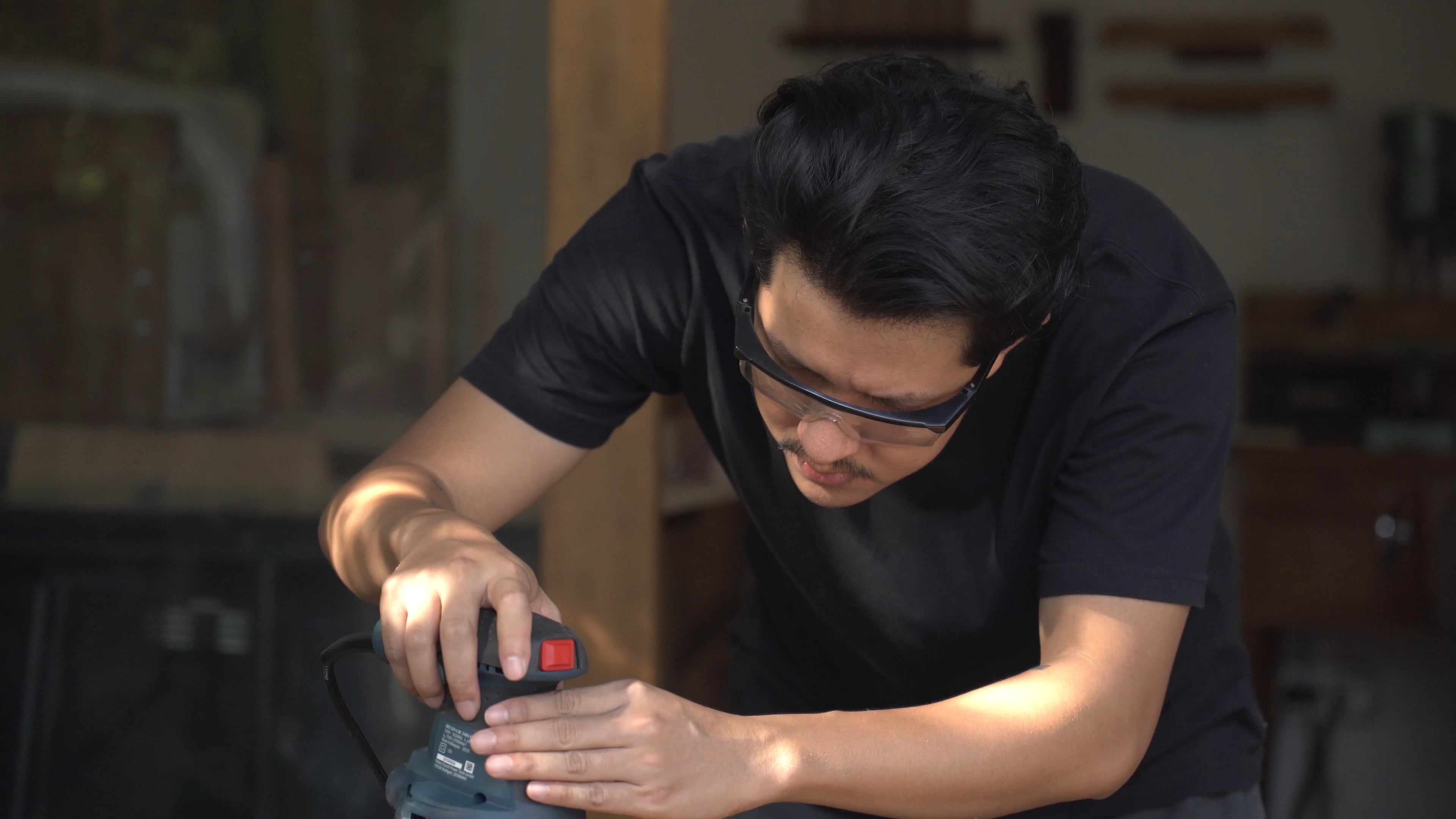A Man Using a Sanding Machine on a Wood Plank Free Stock Video Footage ...