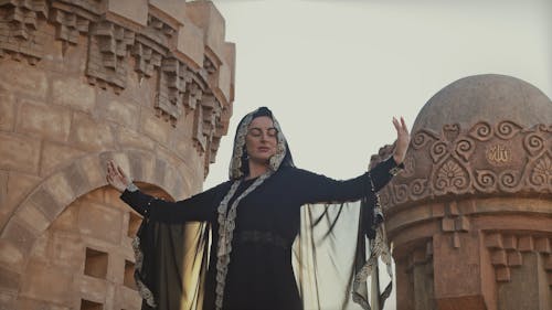 A Woman Dancing From The Palace Tower