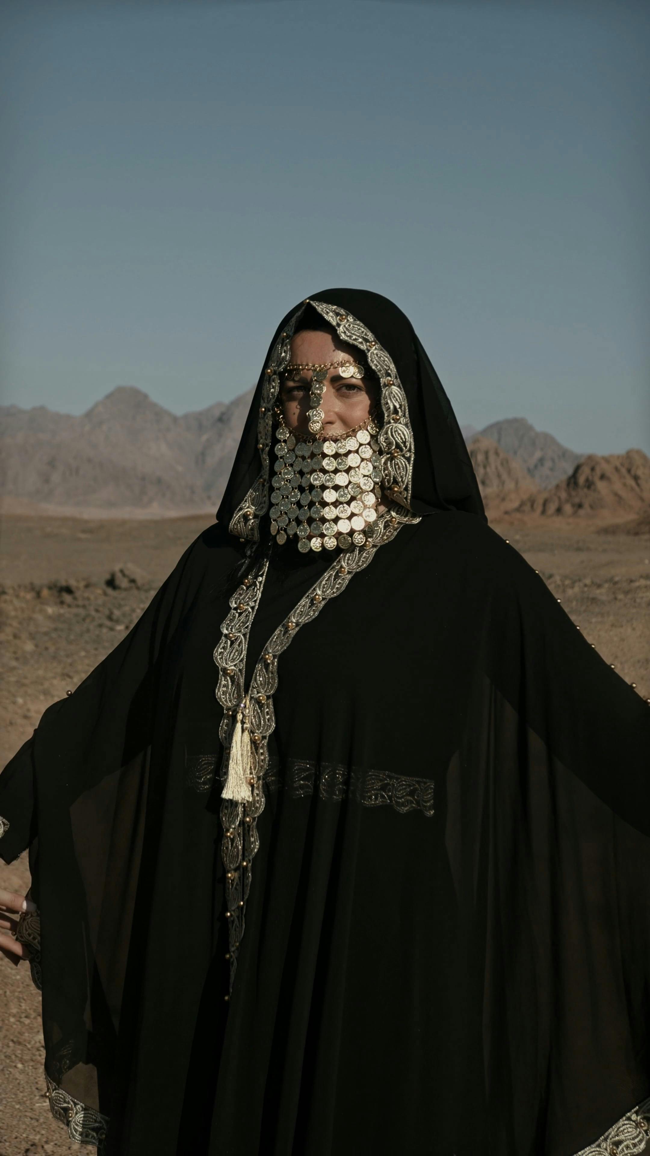 Woman Posing in Desert Wearing Traditional Abaya · Free Stock Video