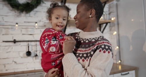 A Mother Playful Moments With Her Child While On A Video Call