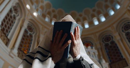 Low Angle View of An Elderly Man Praying