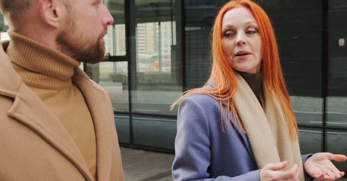 A Man and A Woman Talking While Walking in the Street Free Stock Video ...