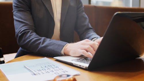 Close-Up View of a Person Using a Laptop