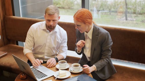 A Man and Woman Having a Meeting in a Café