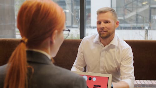 A Man And A Woman Business Meeting In A Coffee Shop