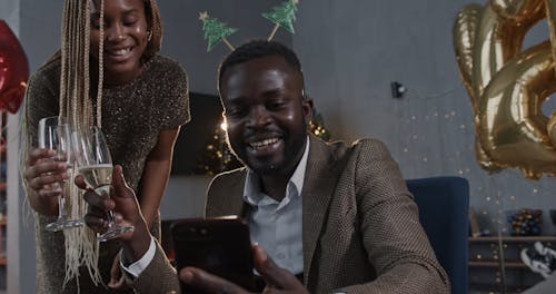 A Couple Celebrating the New Year on a Video Call 