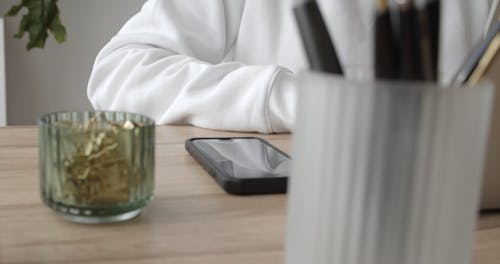 A Woman Looking Frustrated While Using Her Laptop