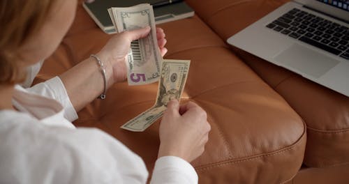 A Woman Segregating Her Money