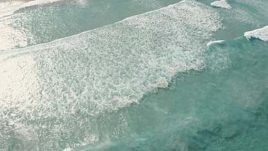waves in a clear beach