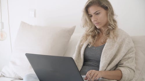 Woman Busy Using Her Laptop
