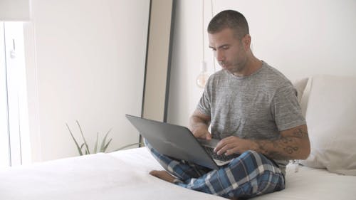 Man Busy Using His Laptop