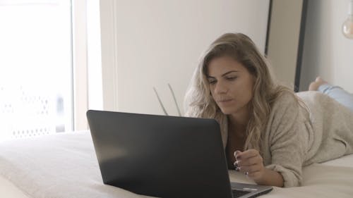 Woman Busy Using Her Laptop