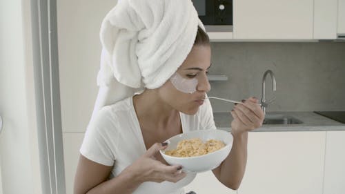A Woman Eating Cereals