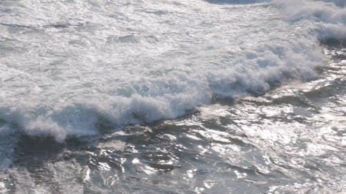 Close Up Shot of Crashing Waves on Rocky Shore