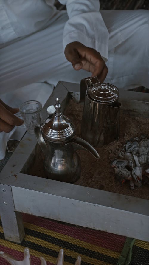 A Man Serving Traditional Hot Tea 