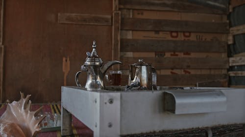 Heating Tea From A Charcoal Flame