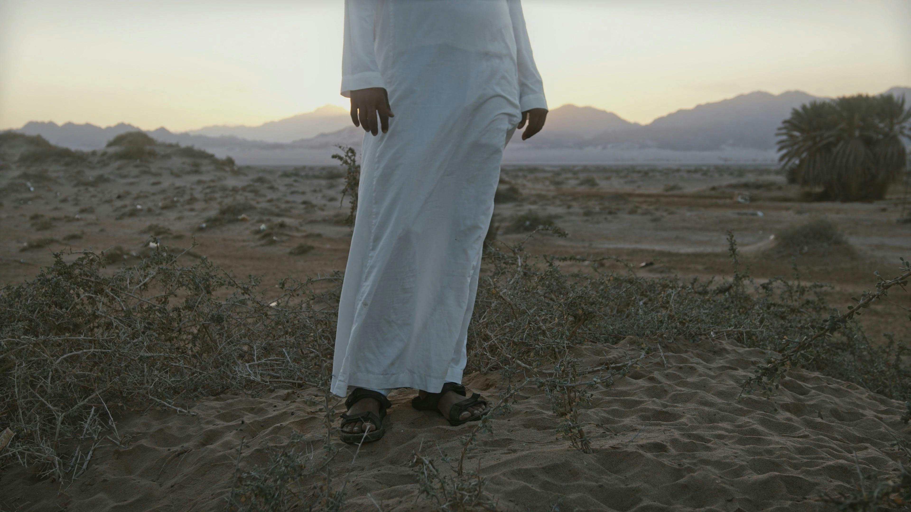 Man Wearing White Thawb Standing Outdoors · Free Stock Video