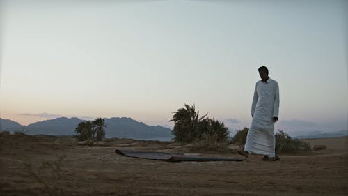 Arab Man Praying Out in the Desert