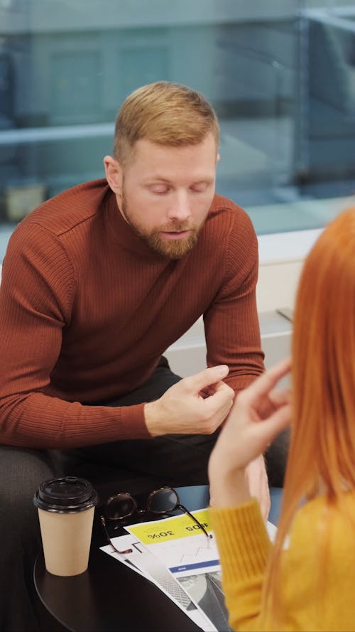 Man and Woman Talking and Discussing With Each Other