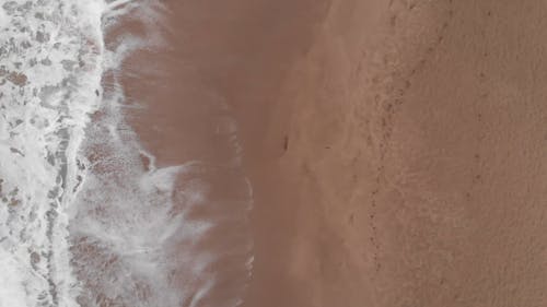 Drone Footage Of Waves In a Beach